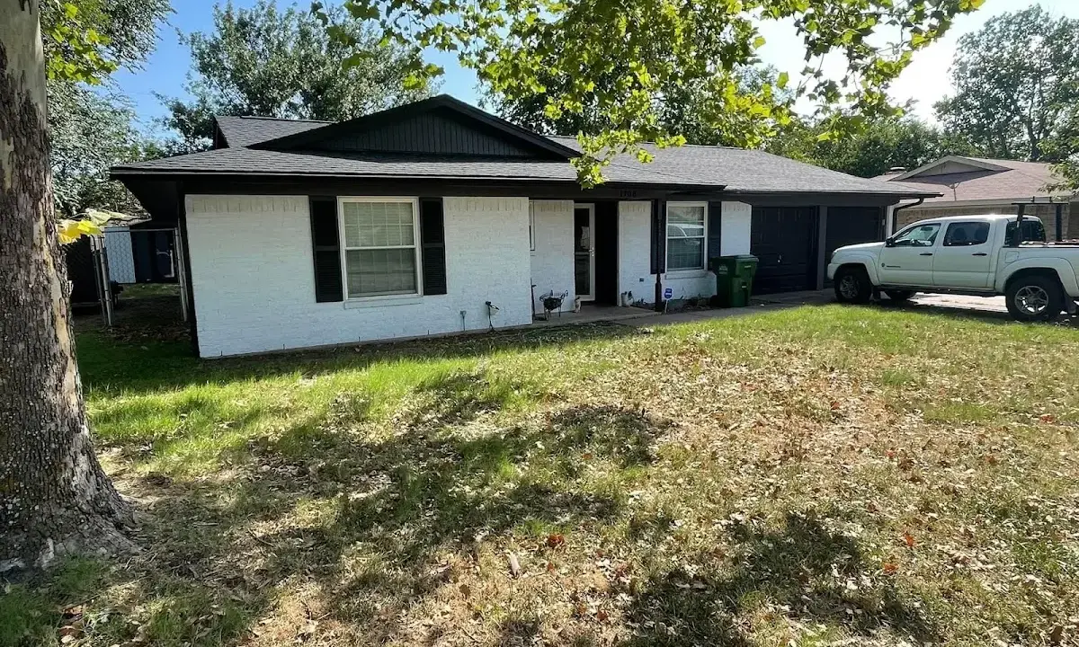 Professional roofing crew working on a residential roof in Lisbon